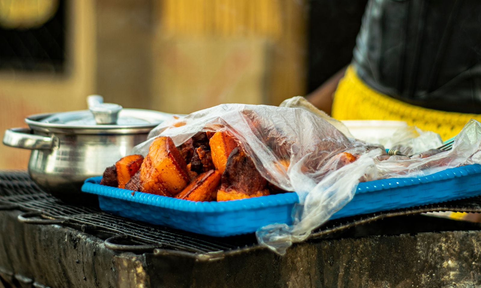 A township vendor preparing food at a local shisanyama stall